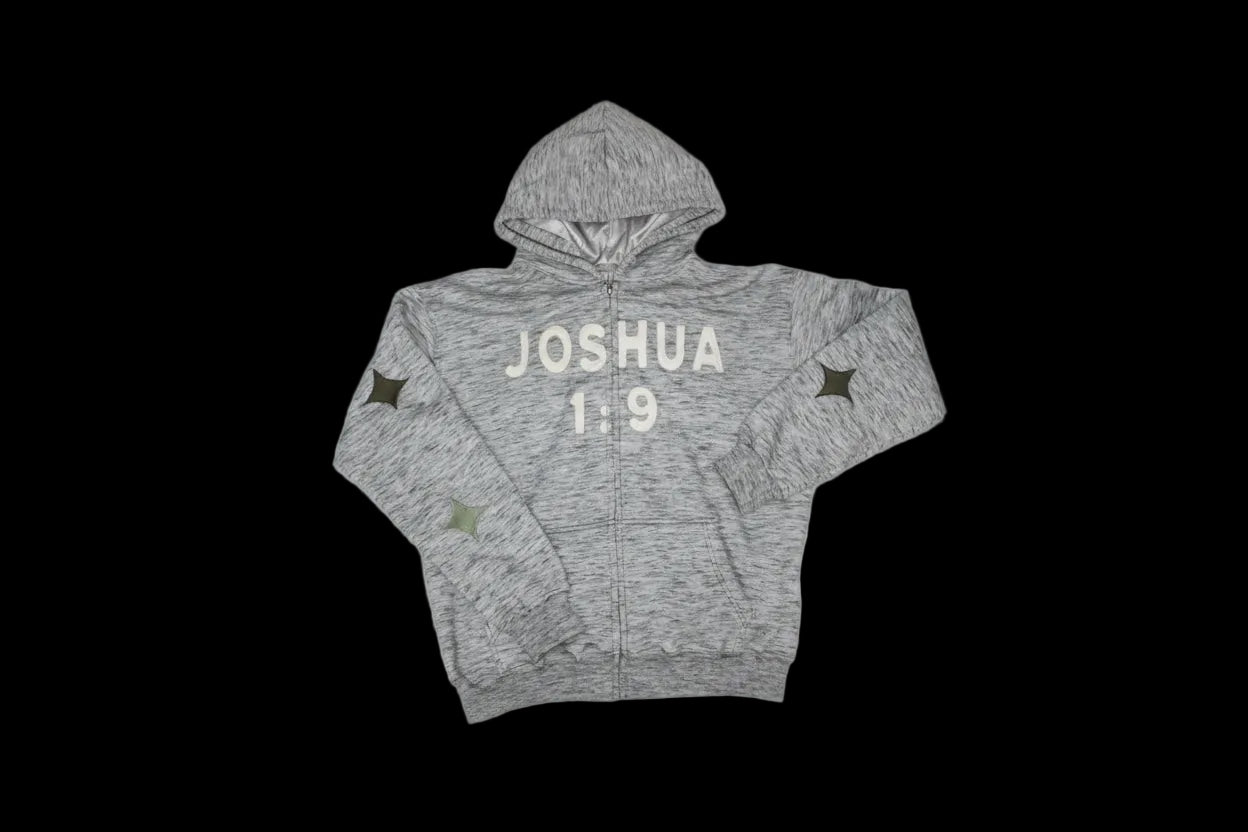 Gray jacket with embroidered ‘JOSHUA 1:9' text on a light gray background