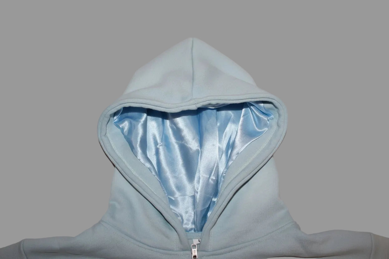 Light blue jacket  with shiny interior lining which is good for the hair protection 